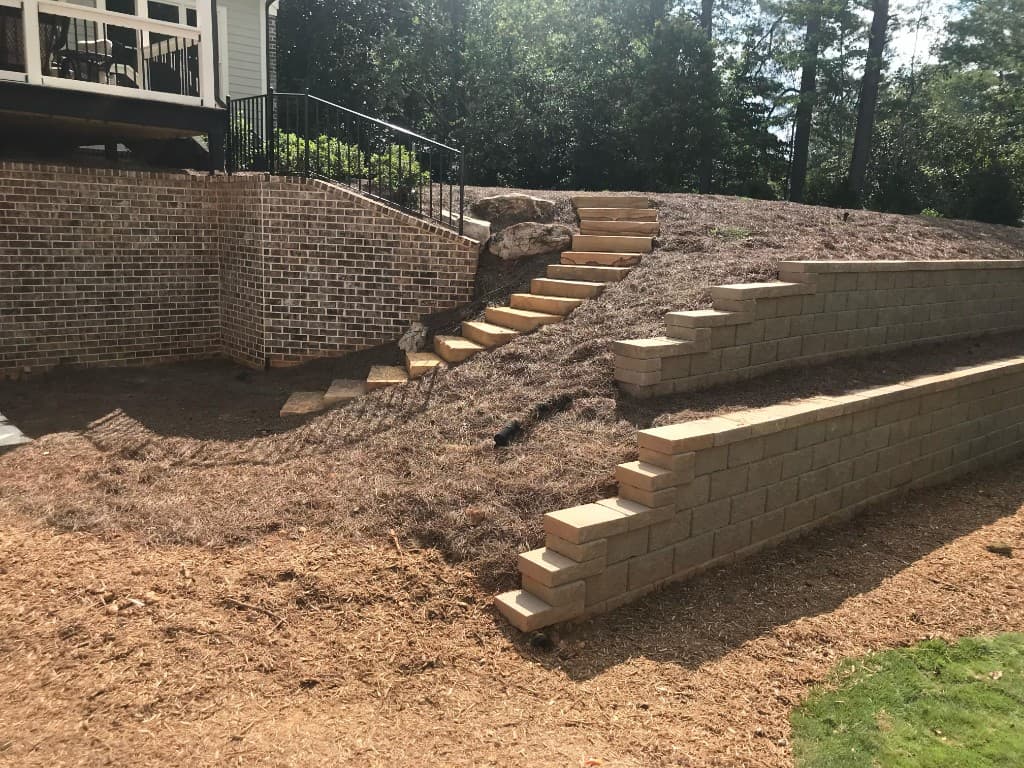 Tiered retaining wall with steps and patio in North Atlanta by Escobar Masonry & Hardscapes